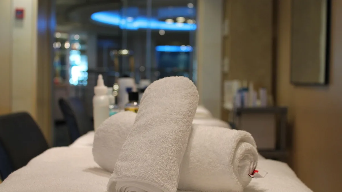 Rolled towels ready in a bright treatment room